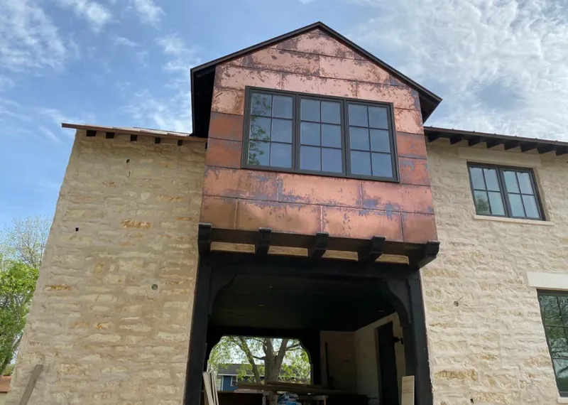 Copper metal panel facade on a stone building for Skylight Installation in Palisades Park