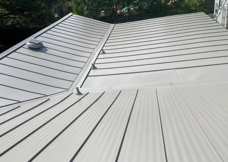 Solar attic fan installed on a metal roof for Roof Ventilation in Palisades Park